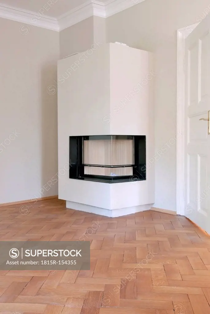 Germany, Fireplace in empty room