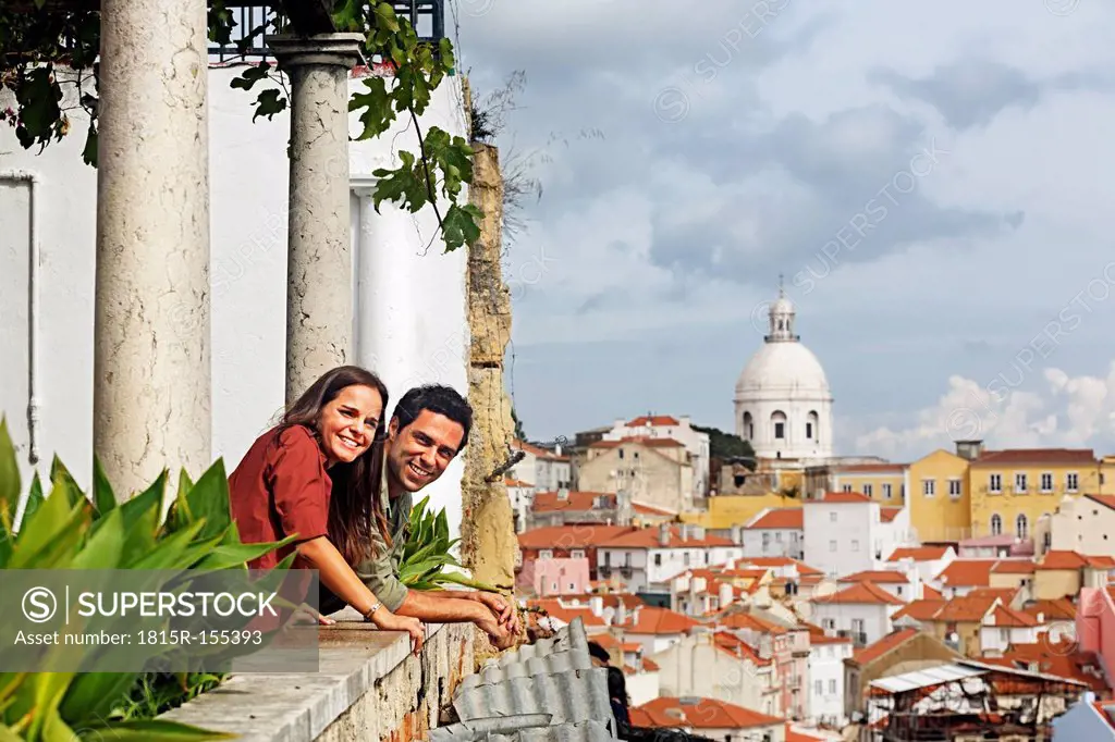Portugal, Lisboa, Alfama, Miradouro de Santa Luzia, young couple looking at view