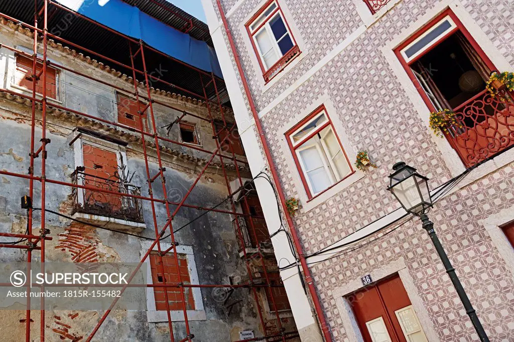 Portugal, Lisbon, Alfama, facades of a decaying and a refurbished residential house