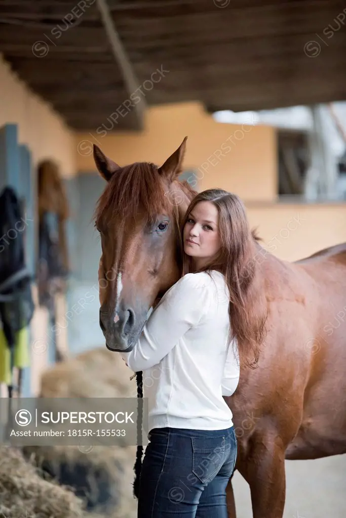 Germany, NRW, Korchenbroich, Young woman with her horse