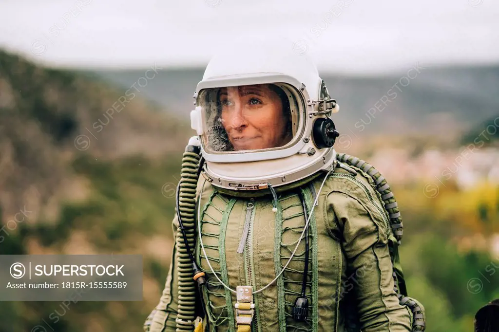 Portrait of woman in space suit exploring nature