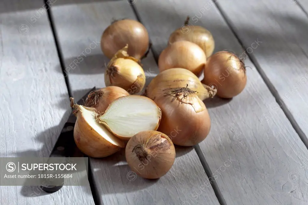 Onions on wooden table
