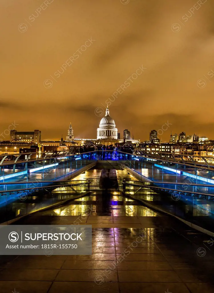 UK, London, view from Millennium Bridge to illuminated St Pauls Cathedral