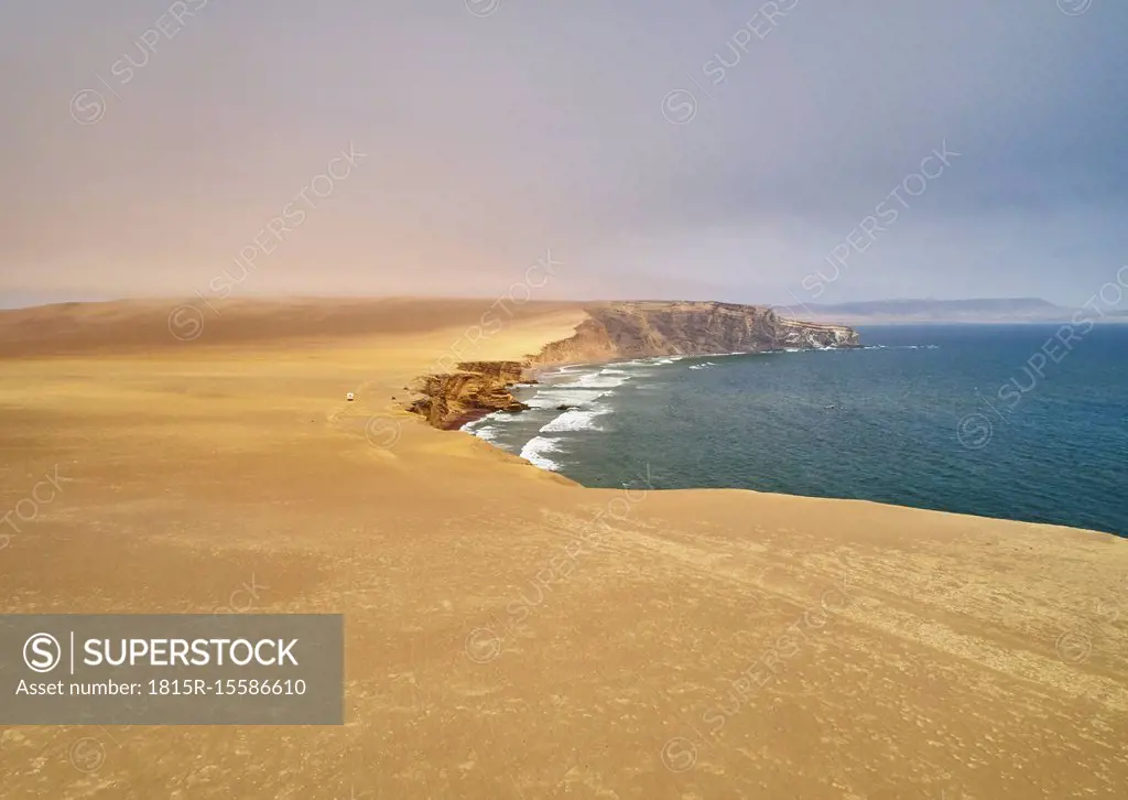 Peru, Paracas, camper at cliff coast in National Park Paracas