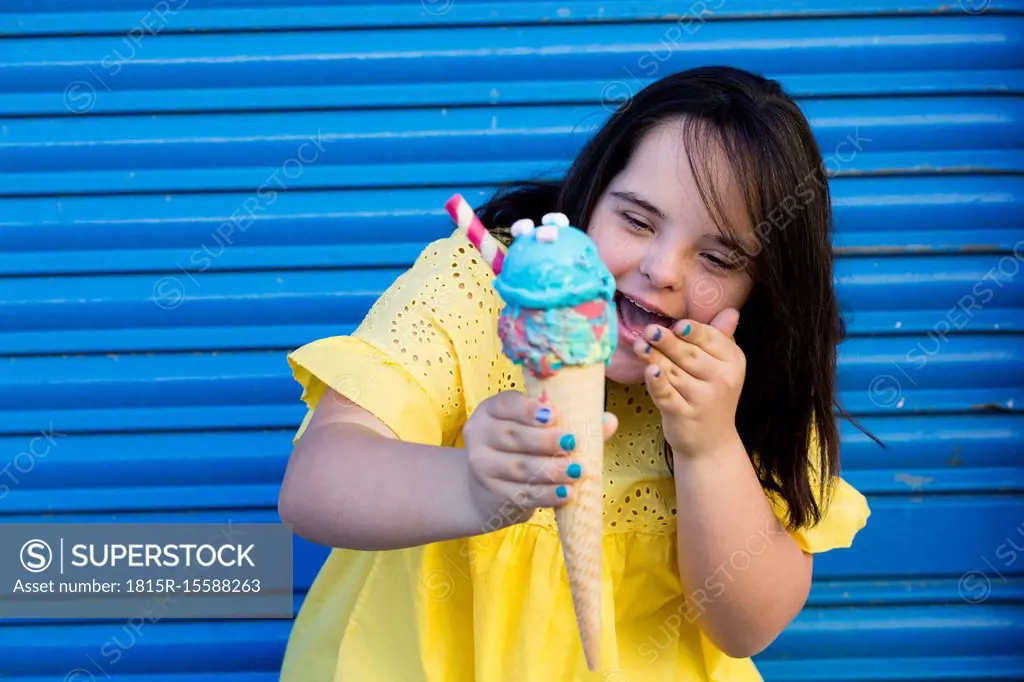 Teenager girl with down syndrome enjoying an ice cream