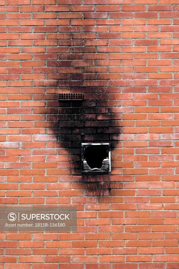 Spain, Burnt window in brick wall