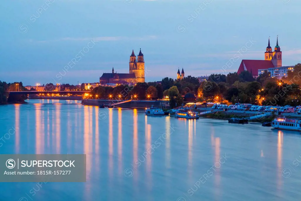 Germany, Saxony-Anhalt, Magdeburg, Cityscape with River Elbe at dusk