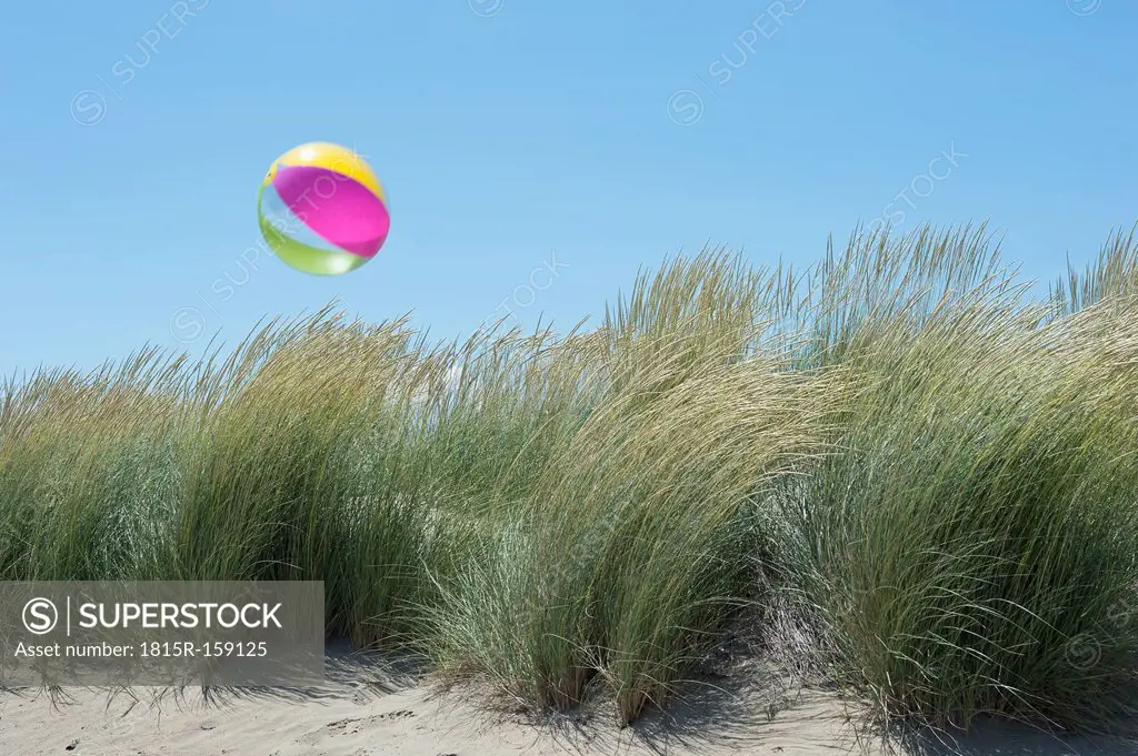 Italy, Beach dunes at Adriaic sea with beach ball