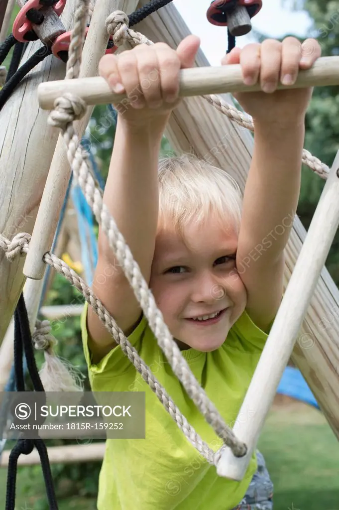 Little boy at climbing frame
