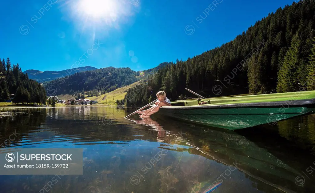 Austria, Salzburg State, Altenmarkt-Zauchensee, woman and boy in a boat