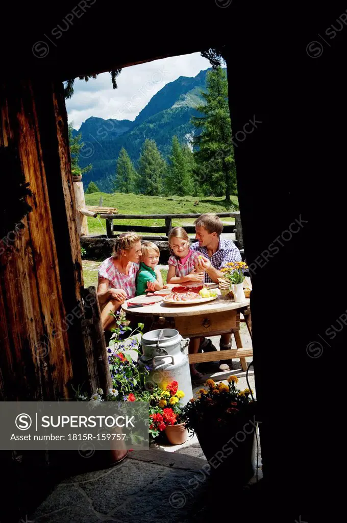 Austria, Salzburg State, Altenmarkt-Zauchensee, family having an alpine picnic