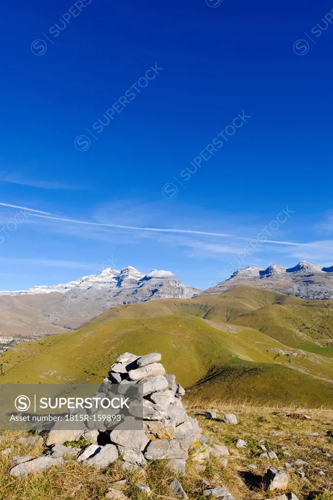 Spain, Aragon, Central Pyrenees, Canon de Anisclo, Ordesa y Monte Perdida National Park, cairn and Las Tres Marias in the background