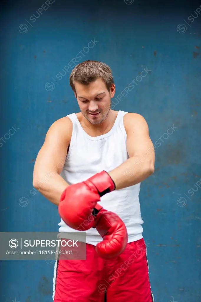 Boxer with red boxing gloves preparing for a fight