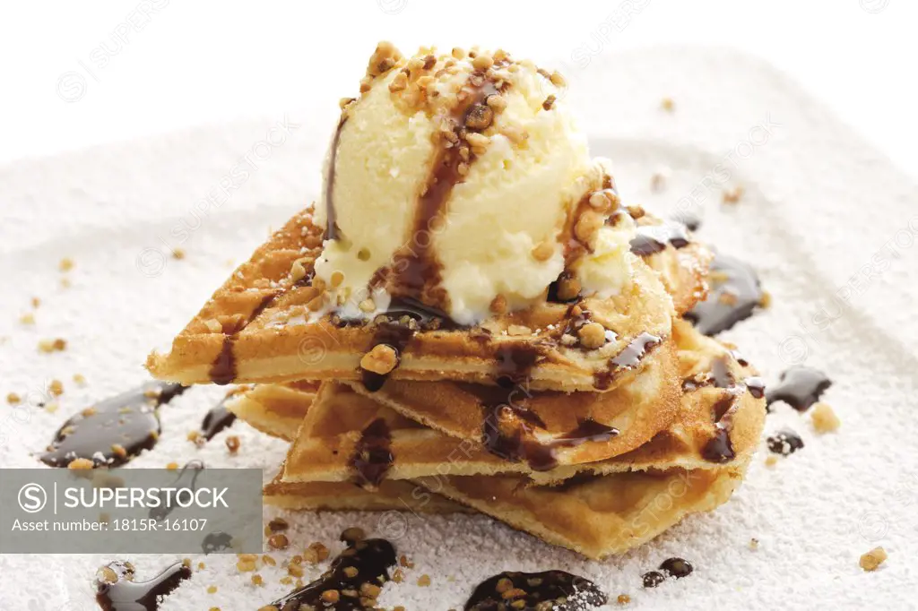 Heart shaped waffles with vanilla ice cream and brittle, close-up