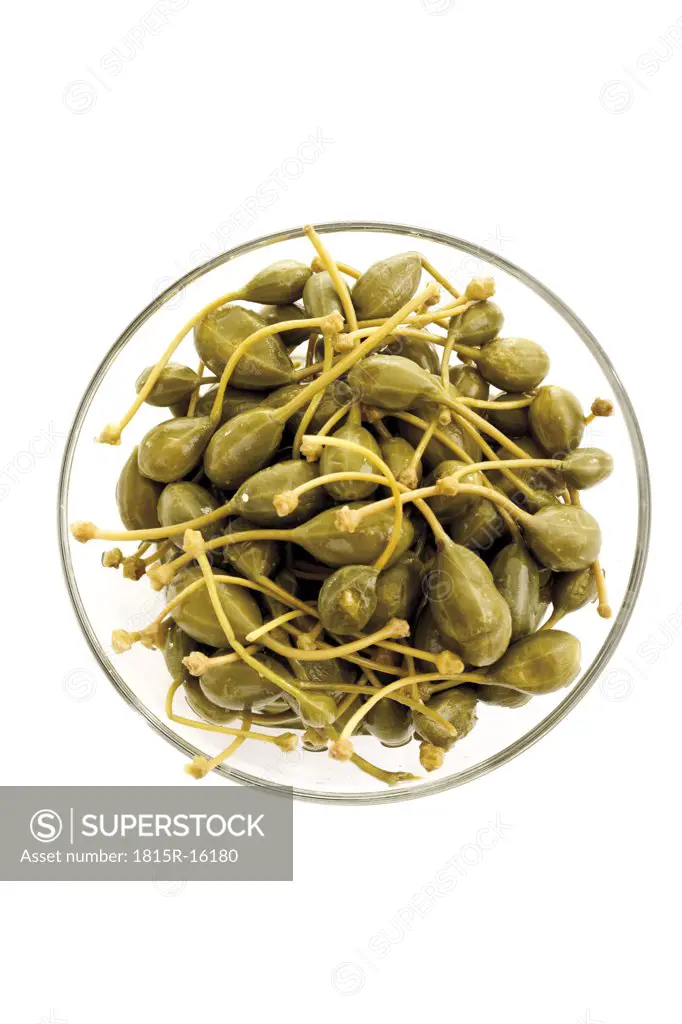 Caper fruits (Capparis spinosa) in bowl, elevated view