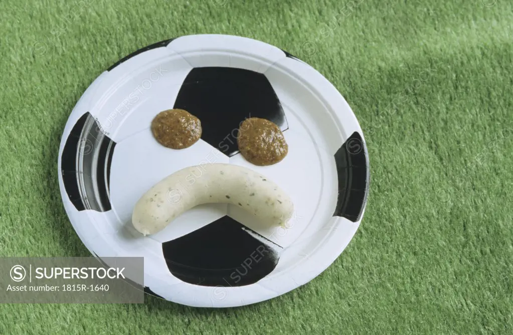 Weisswurst, white sausages on a football plate