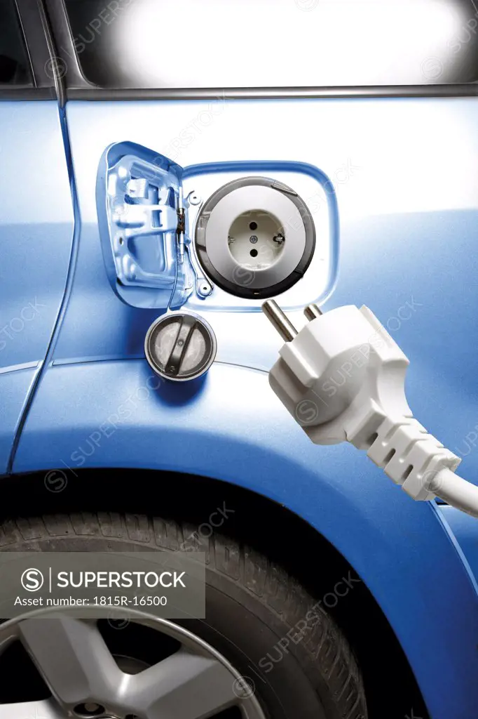 Electric plug and electric car, close-up