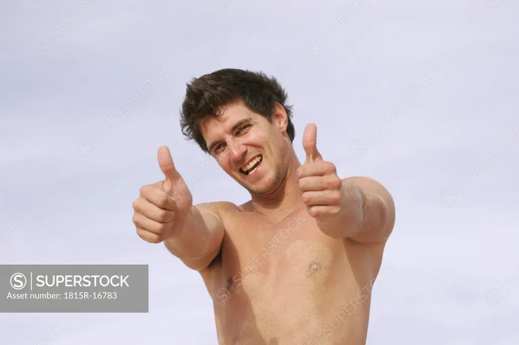 Man with thumbs up, naked chest