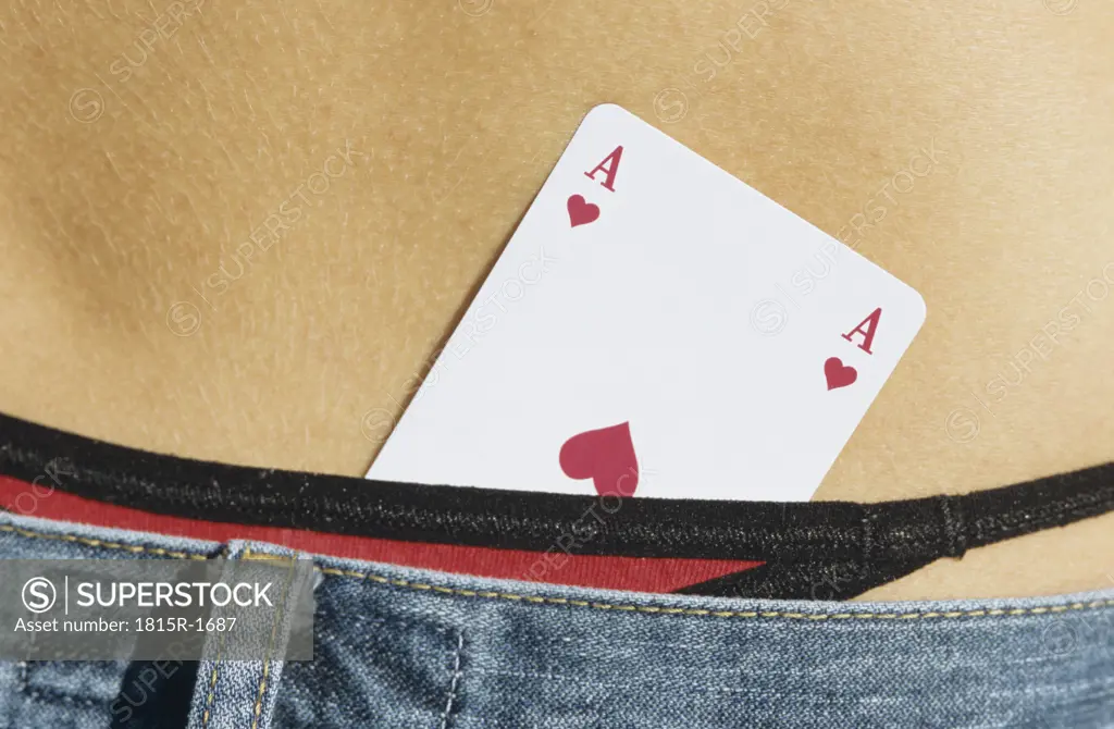 Ace of heart card sticking in trouser