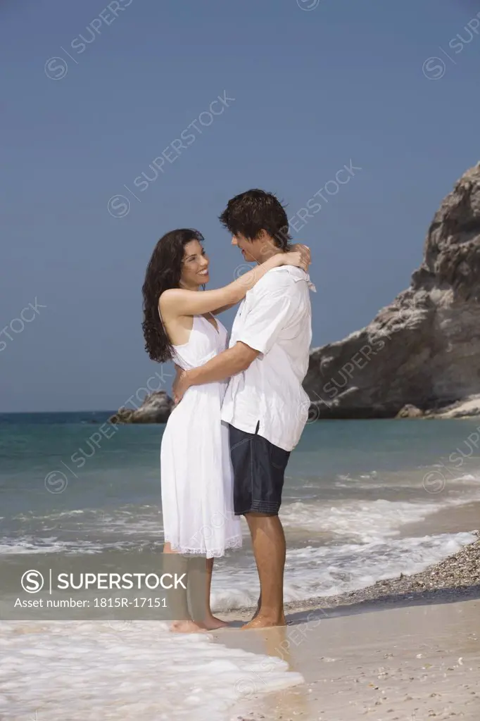 Asia, Thailand, Young couple embracing on beach