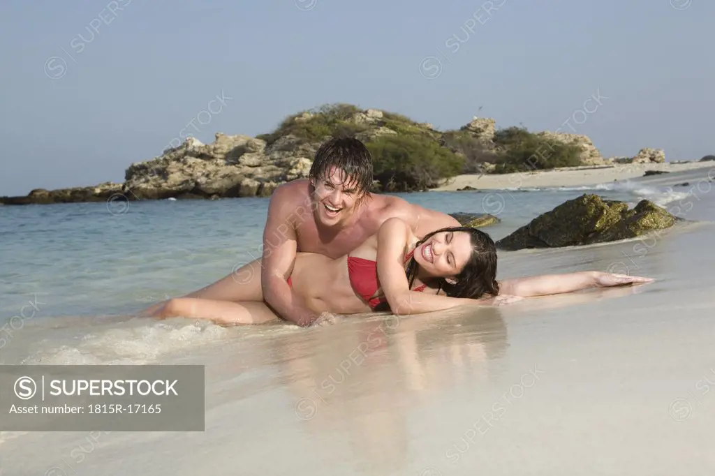 Asia, Thailand, Couple lying on beach