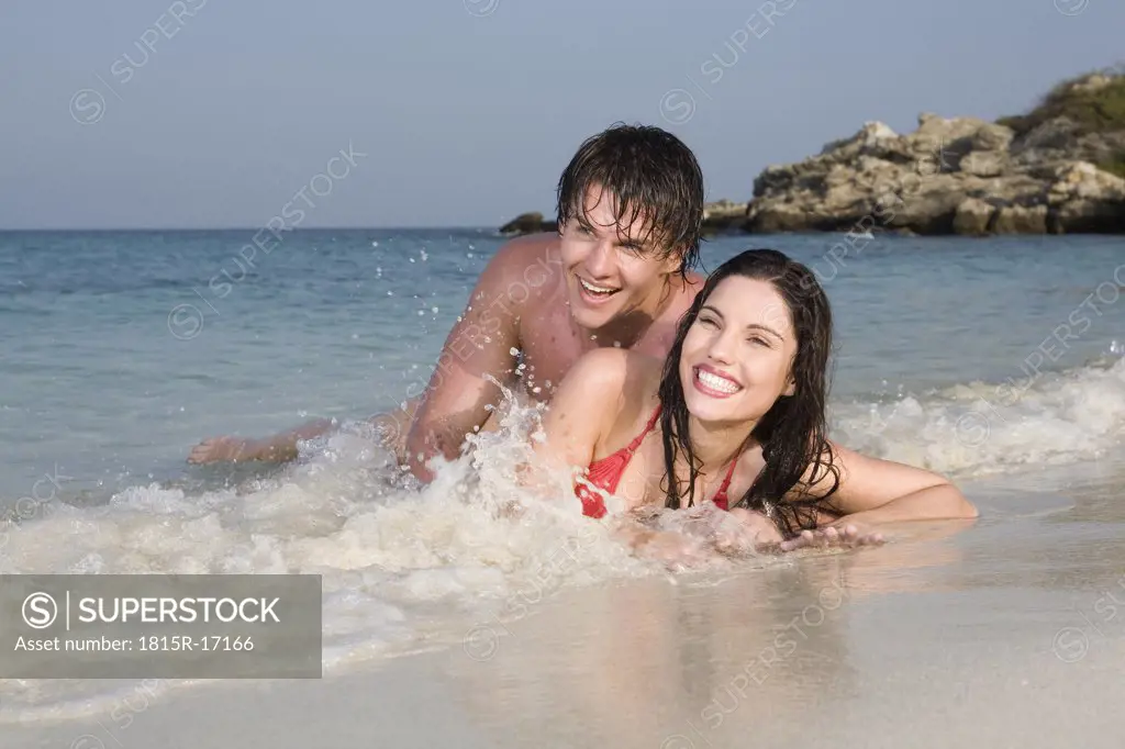 Asia, Thailand, Couple lying on beach