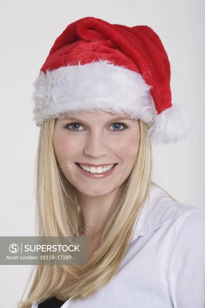 Young woman wearing a Santa Claus hat, portrait