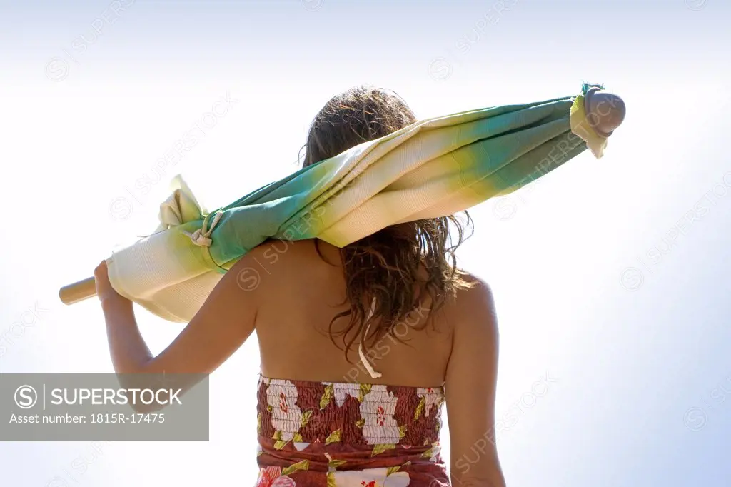 Woman carrying a sunshade