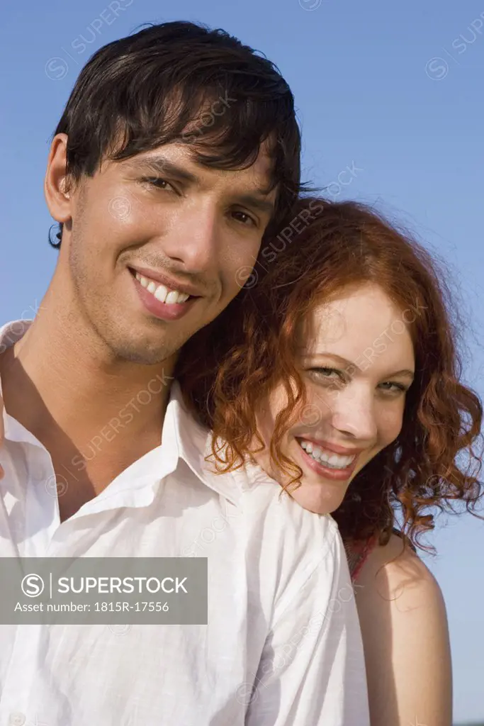 Young couple, smiling, portrait