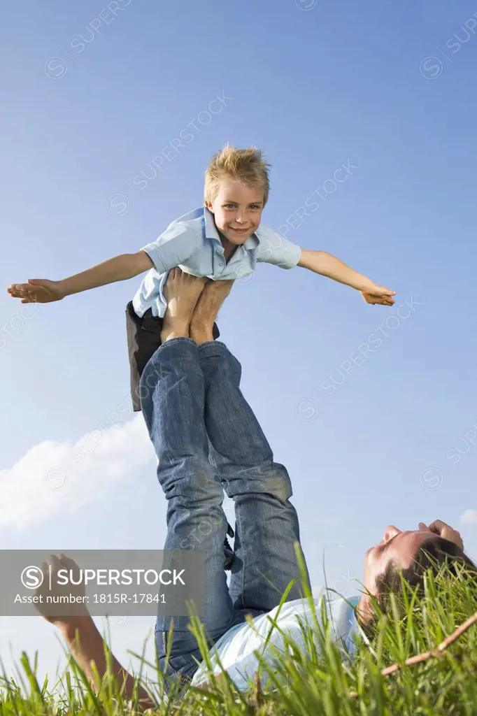 Father lifting son