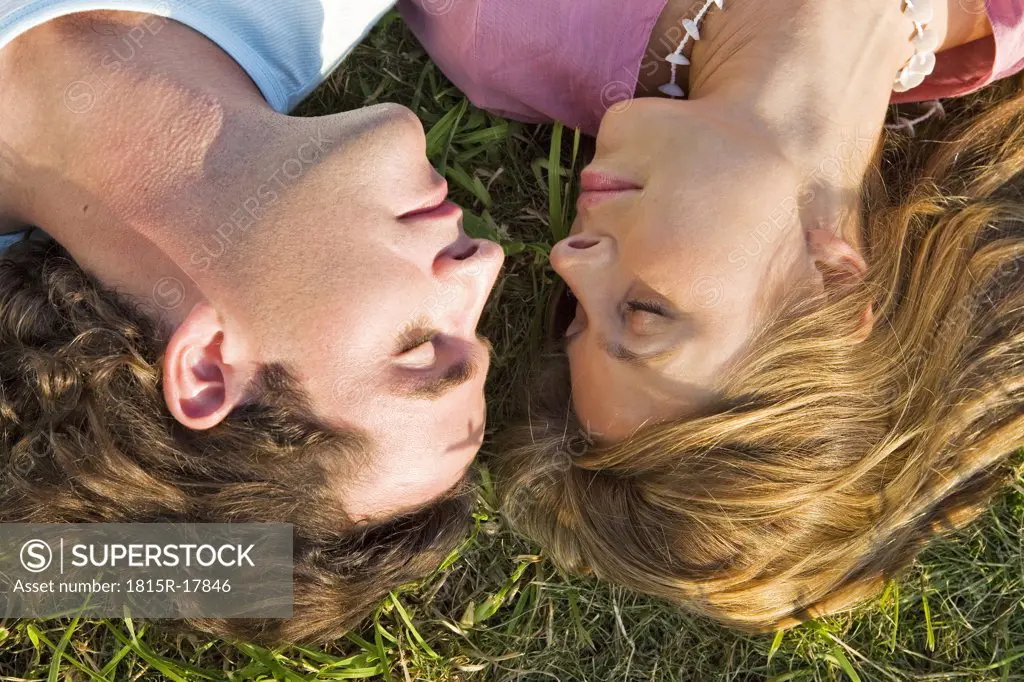 Couple lying in meadow