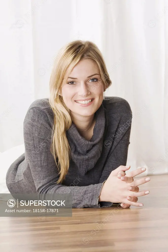 Blonde woman smiling, portrait