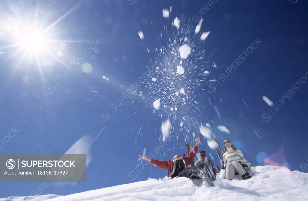 Three people having fun in the snow