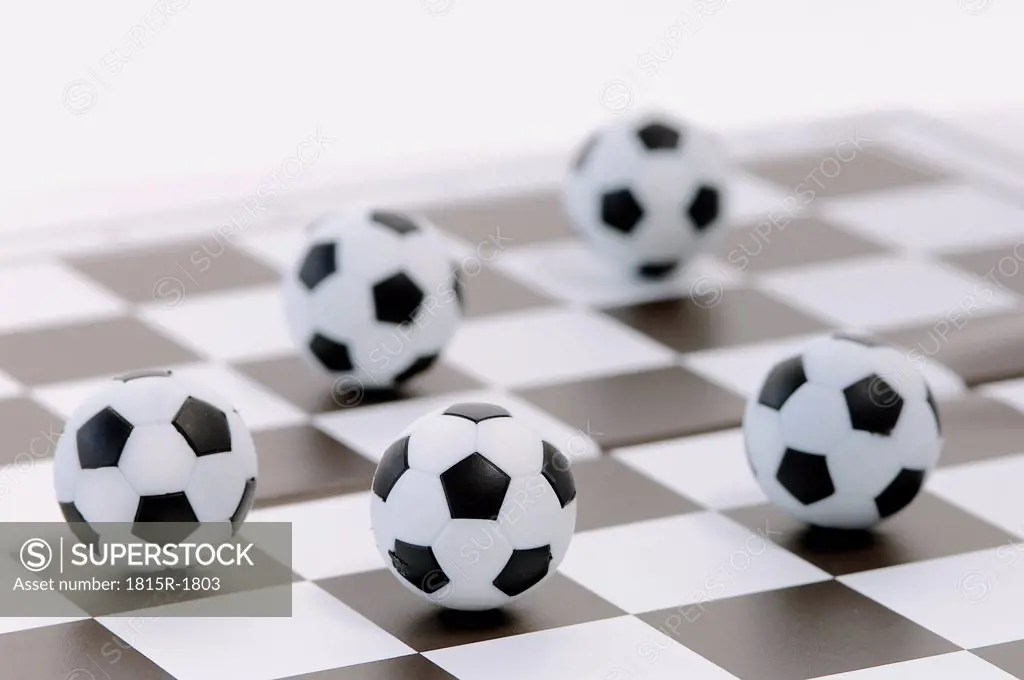 Footballs on a chessboard