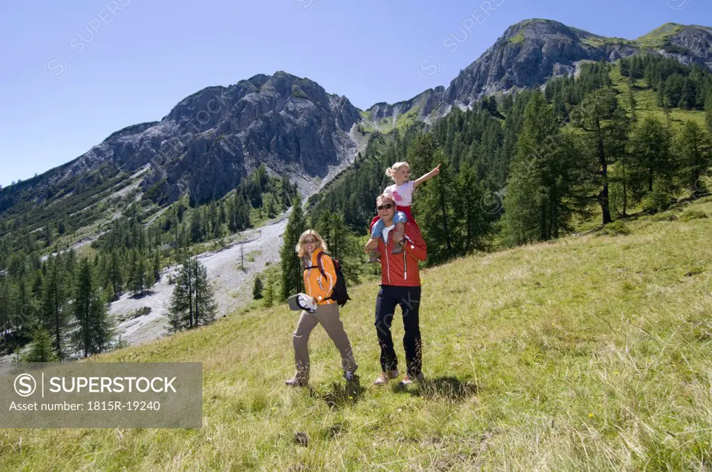 Austria, Salzburger Land, couple with daughter, hiking