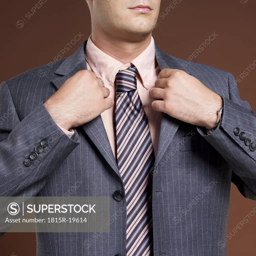 Businessman wearing suit and tie, close-up