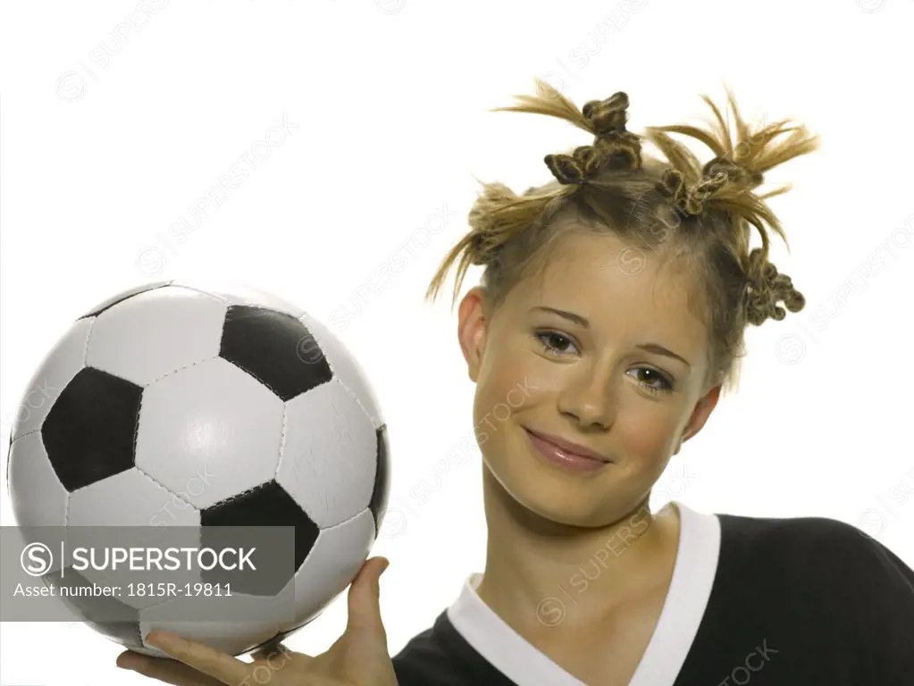 Teenage girl with soccer ball, portrait