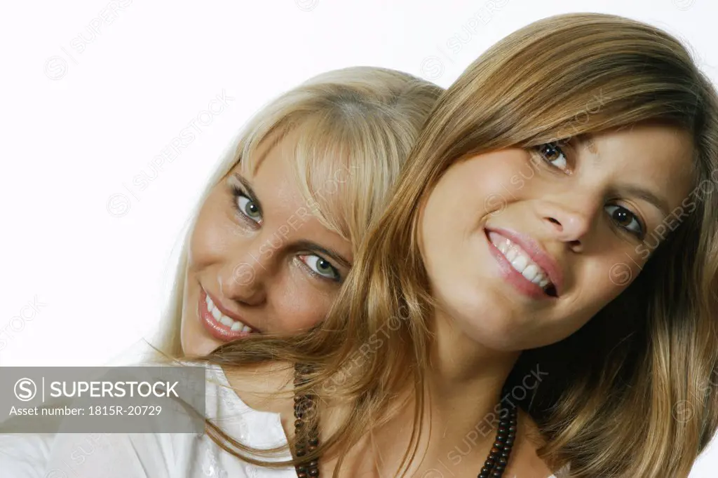 Woman leaning on the other's shoulder
