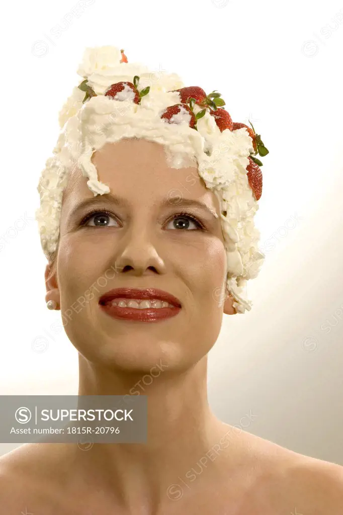 Young woman with cream on head, close-up