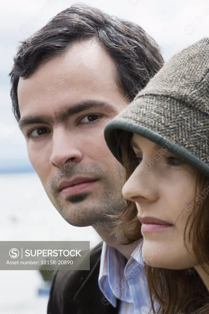 Young couple outdoors, close-up