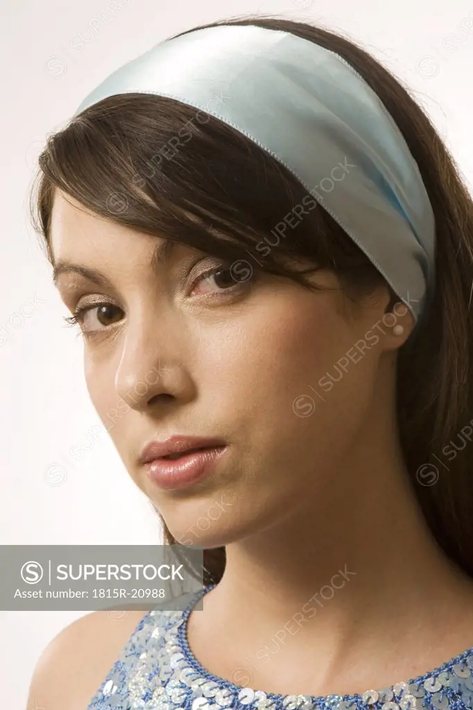 Young woman wearing hair band, portrait, close-up