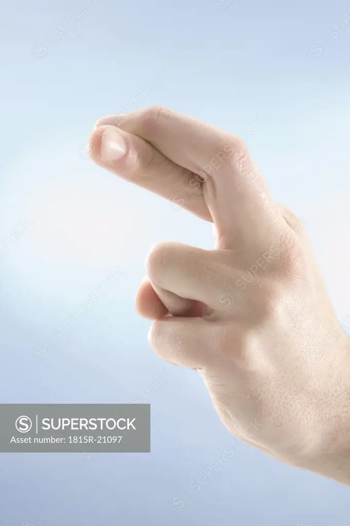 Hnad gesture, fingers crossed, close-up