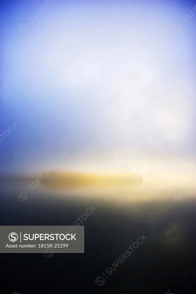 Austria, Salzkammergut, fog over lake Mondsee