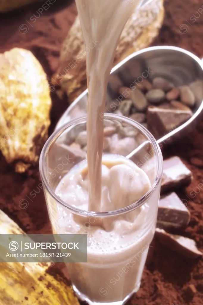 Chocolate drink pouring into glass