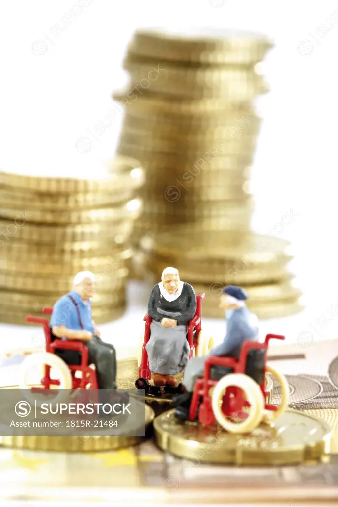 Figurines in wheelchairs on coins