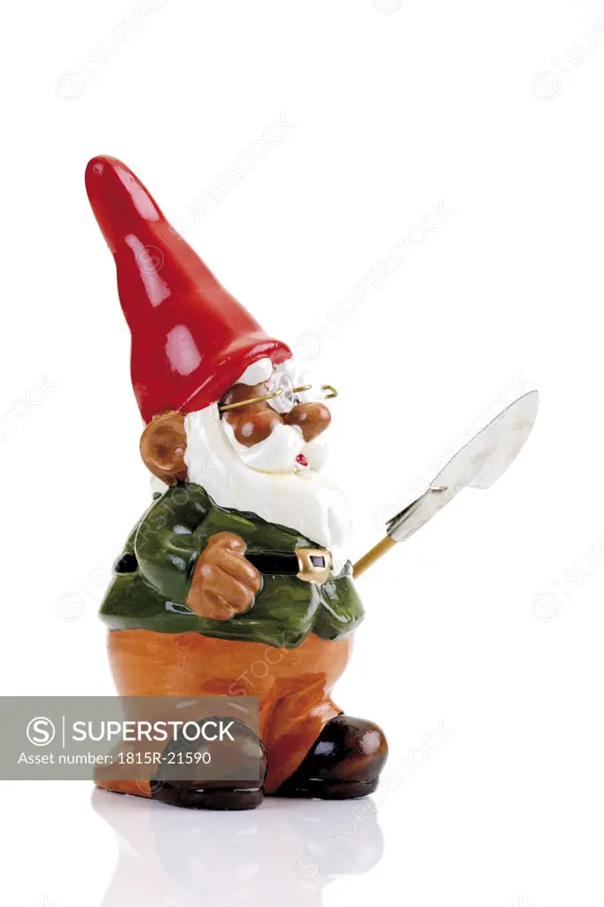 Garden gnome with spade, side view