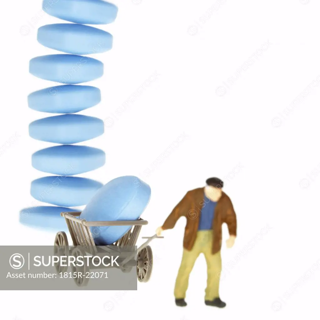 Man pulling trolley with pills piled up