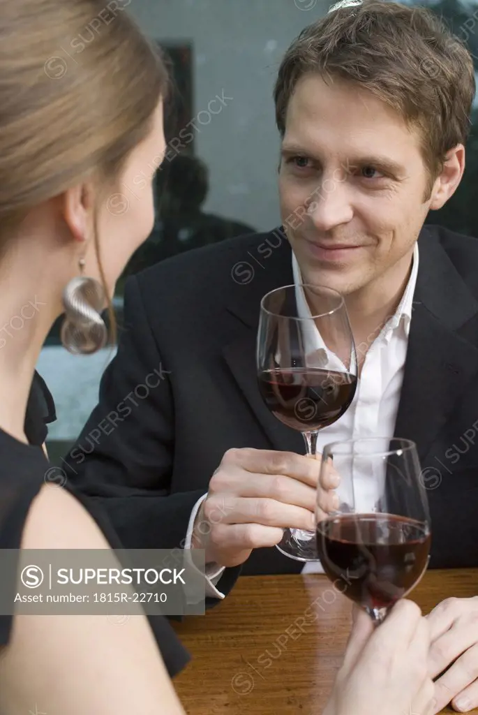 Young couple drinking red wine