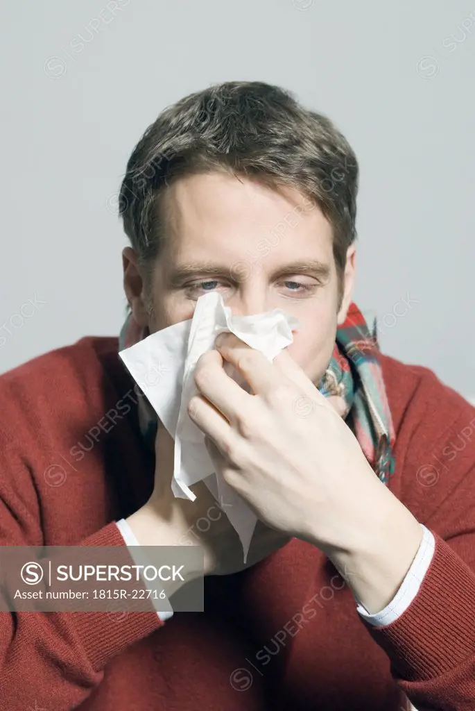 Man blowing his nose