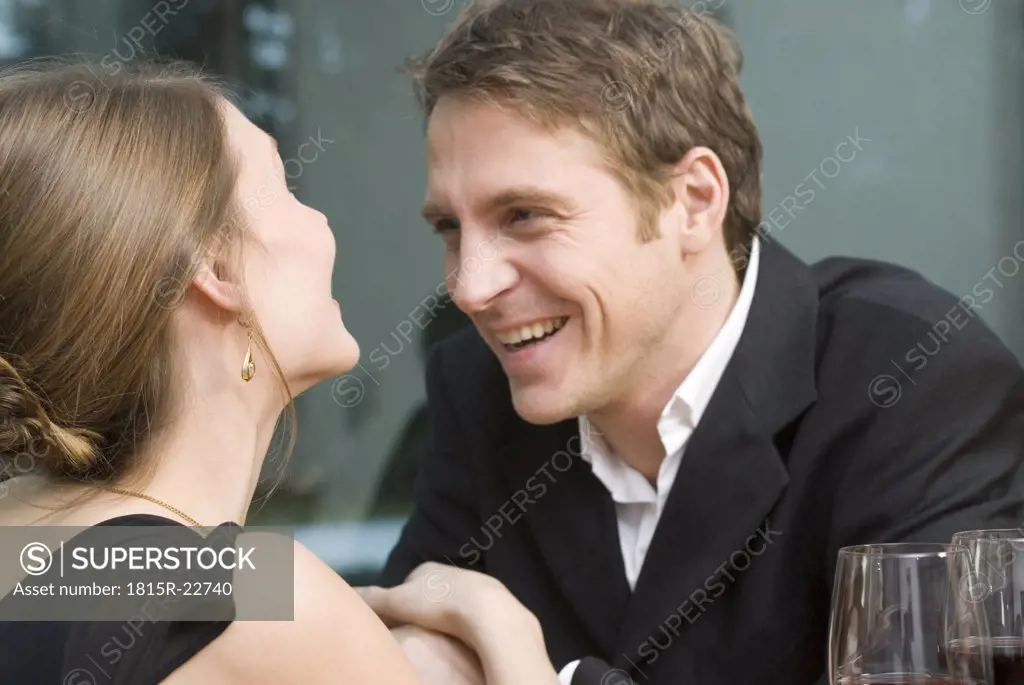 Couple in love laughing happily